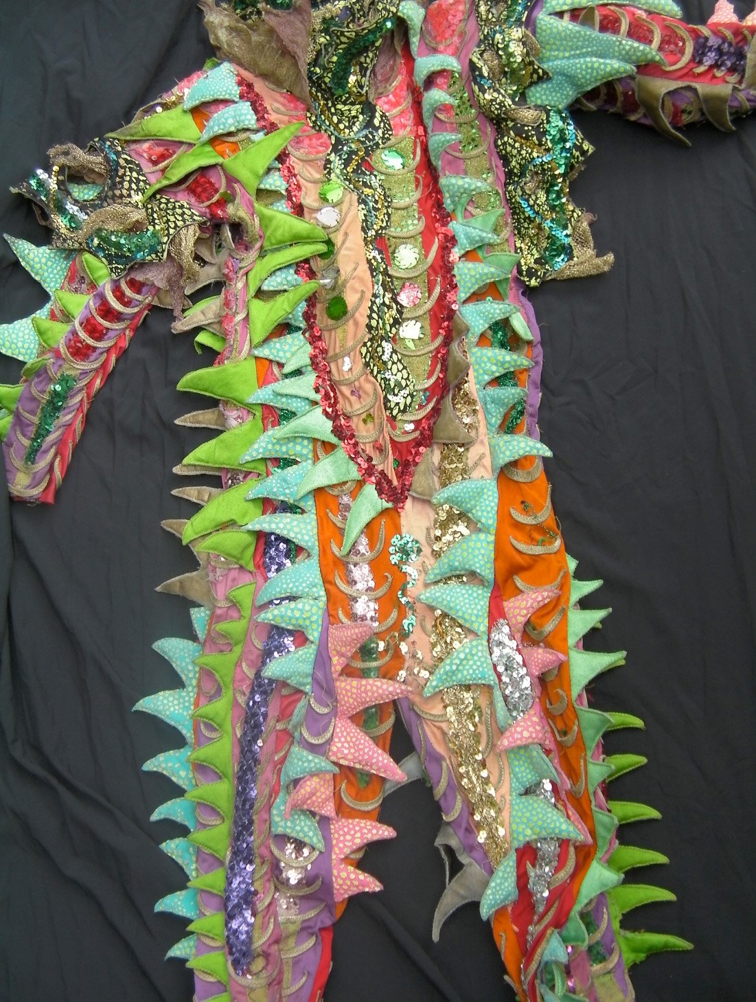 A close up of the Chameleon costume